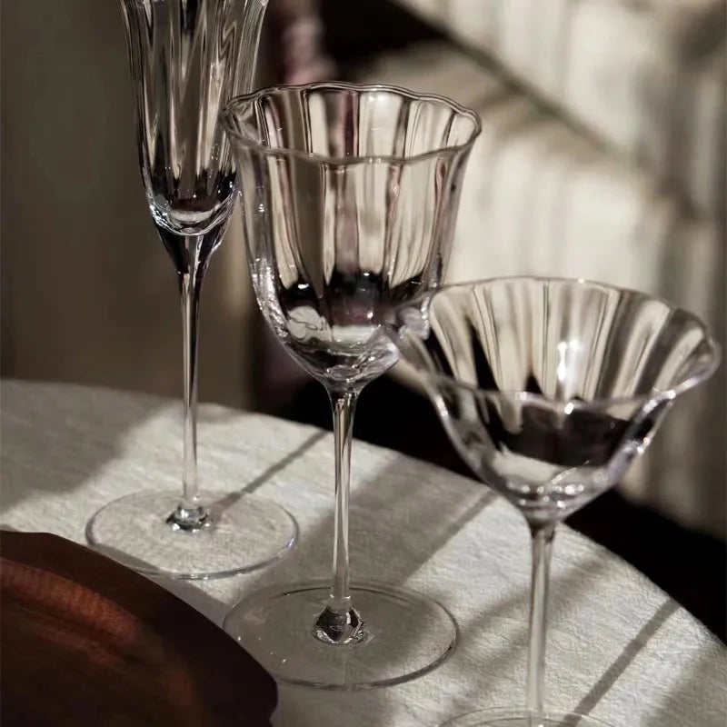 Elegant glassware with delicate stems featured in Lilly & Lula's Tableware and Serveware collection
