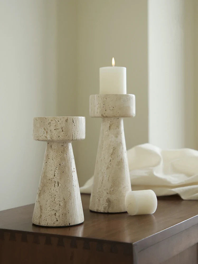 Minimalist stone Candles & Candle Holders set on wooden table with one candle lit and one unlit white candle